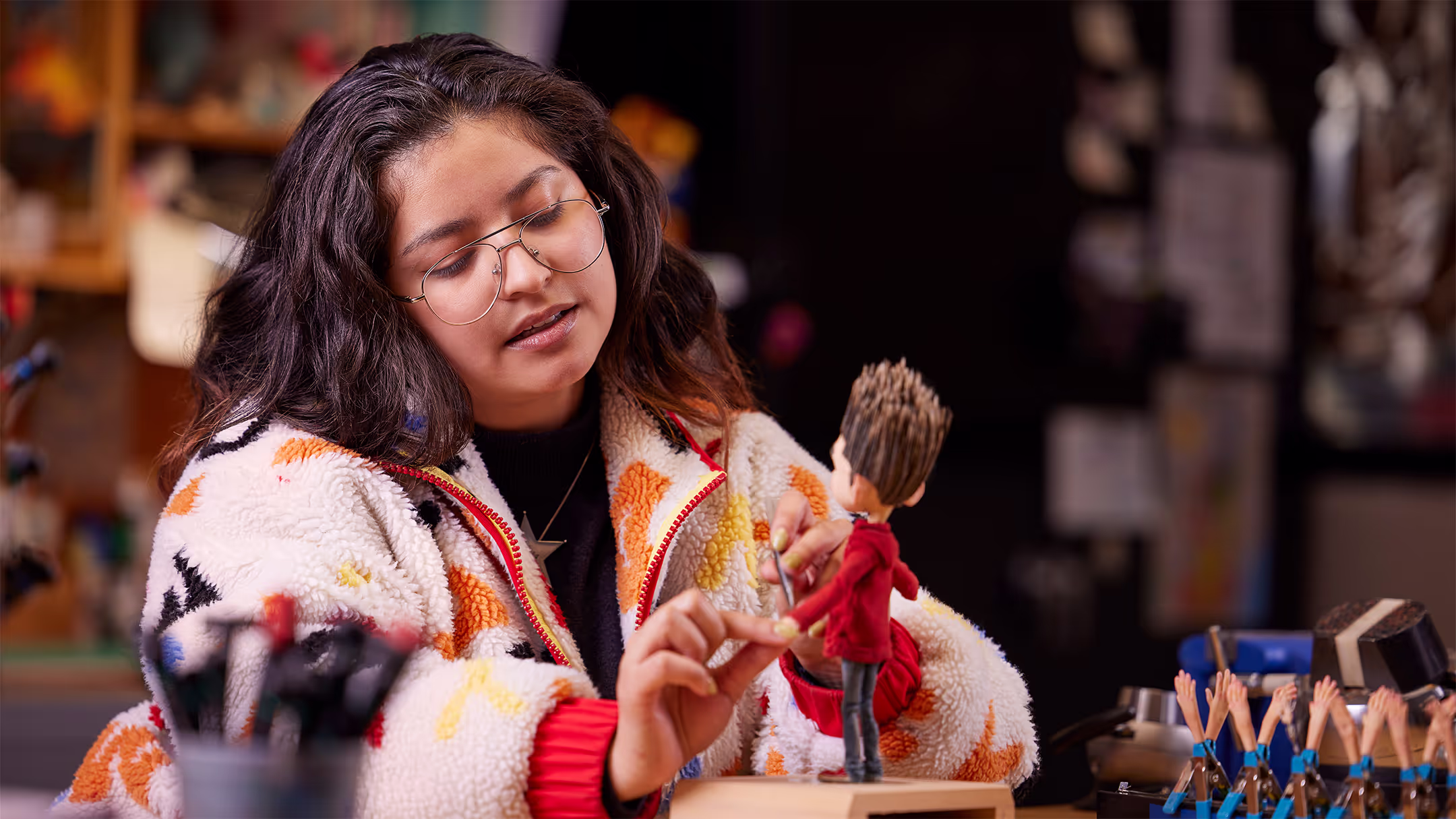 Madeleine adjusts a ParaNorman puppet in the Puppet Hospital